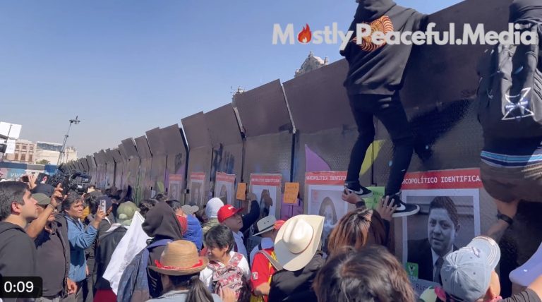 Video: Thousands clash with riot police in Mexico City